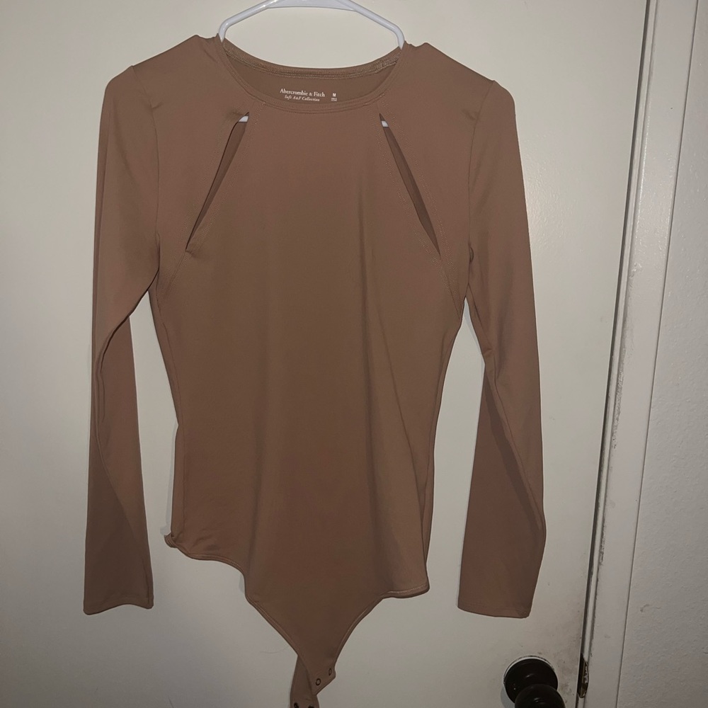 NWOT creamy soft bodysuit with cutouts